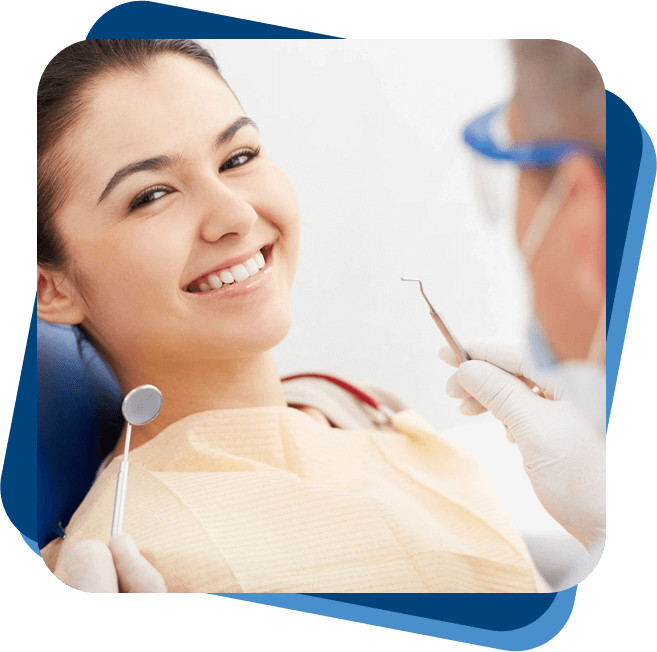 A woman sitting in the dentist chair smiling.